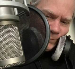 Close-up of a microphone in a soundproof recording studio with an English voiceover actor